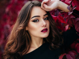 Makeup Inspirations For A Winter Wedding 2023 The beautiful girl stands near walll with leaves-WeddingAffair